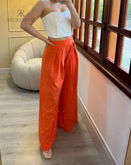 Pantalón palazzo color naranja para mujer, ideal para un look audaz y moderno.